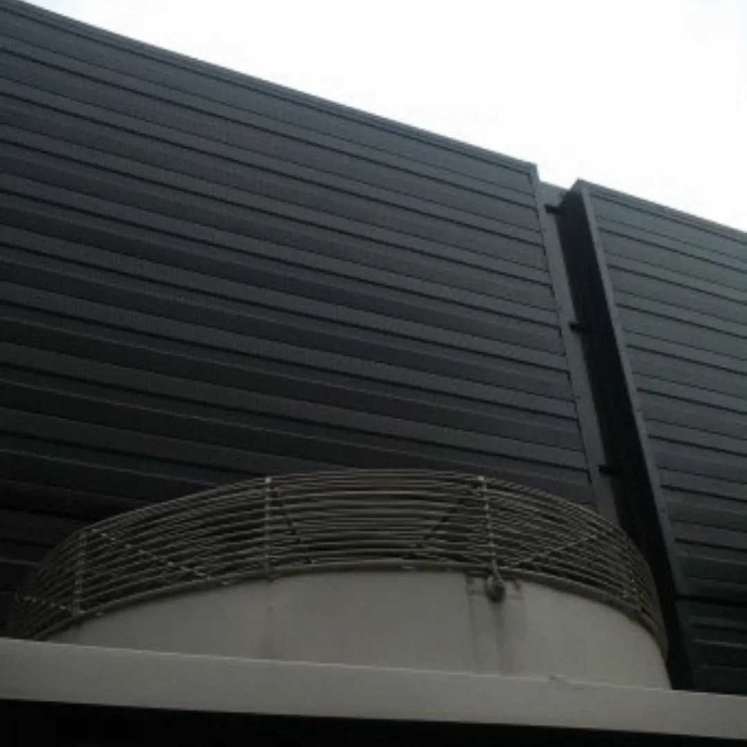 Sound-Absorbing Wall Panels Installed in Gym Near External AC Unit